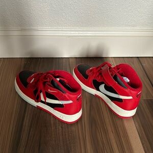 Nike beige, black and red Airforce 1’s